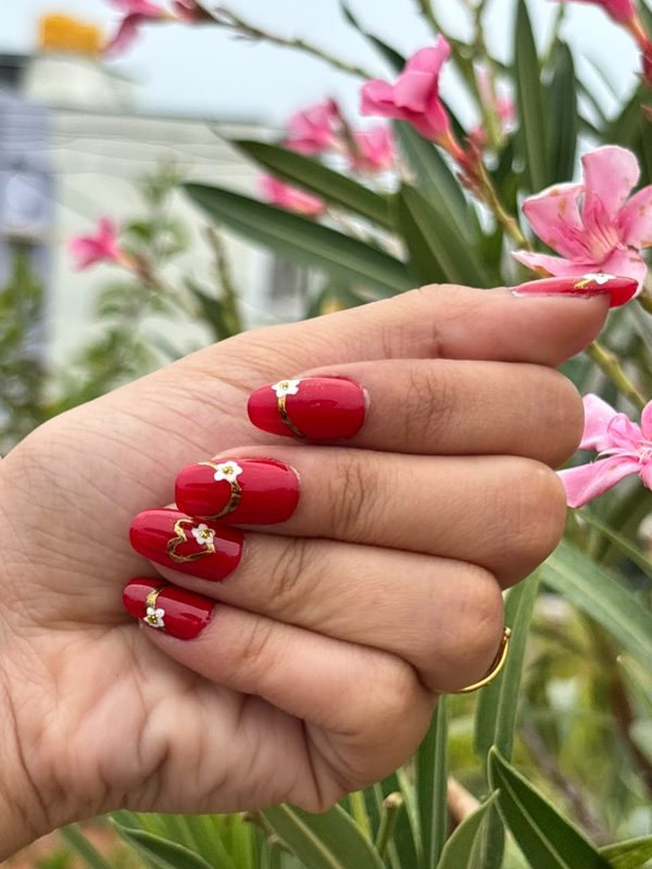 Red nail art with hearts
