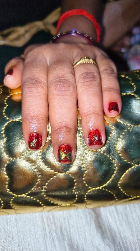 Red gold star nail art Chennai
